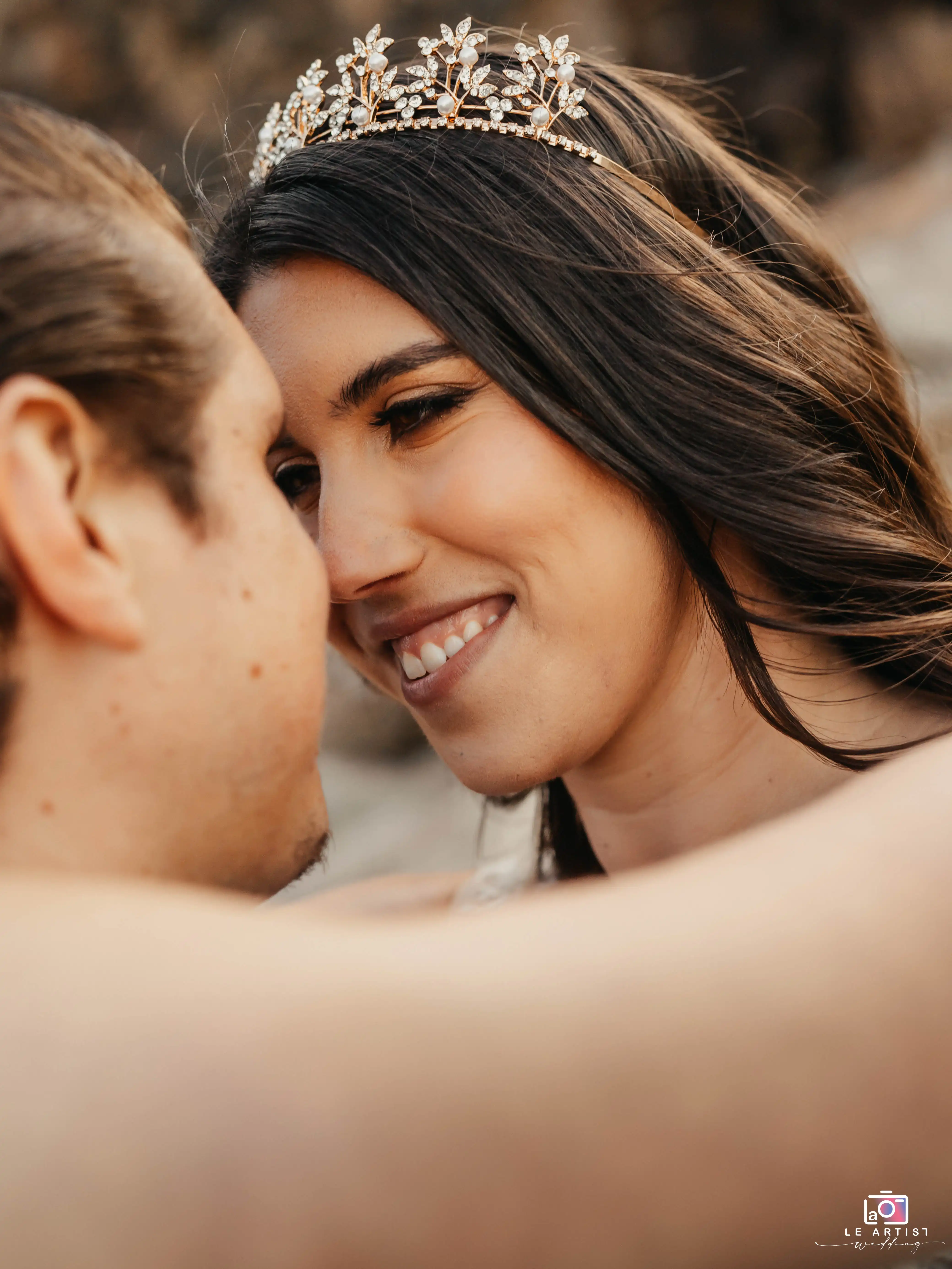 An intimate close-up moment between the couple, highlighting their connection and joy on their special day. Le Artist Wedding
