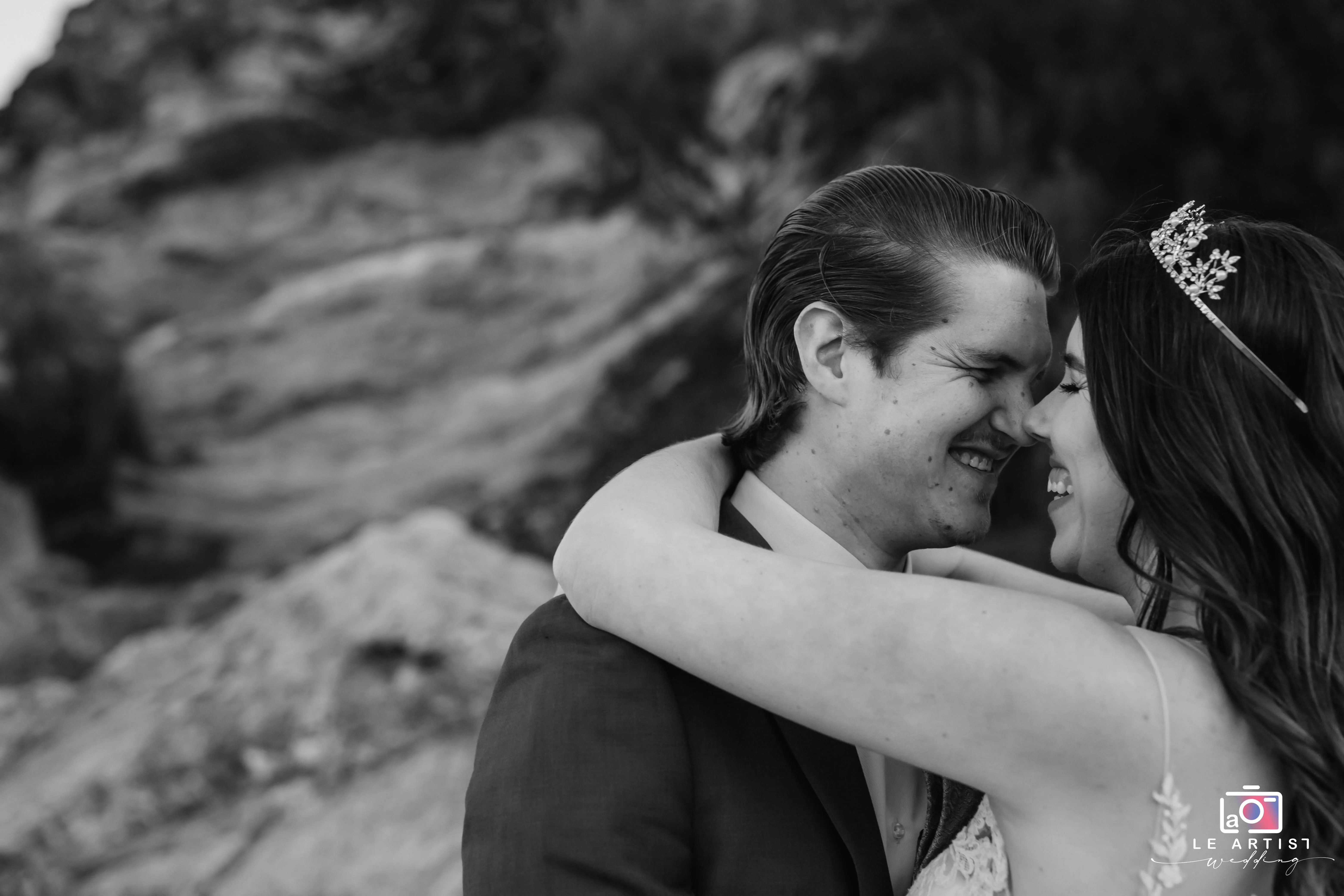 A joyful and intimate moment between the newlyweds, capturing their happiness and closeness. Le Artist Wedding