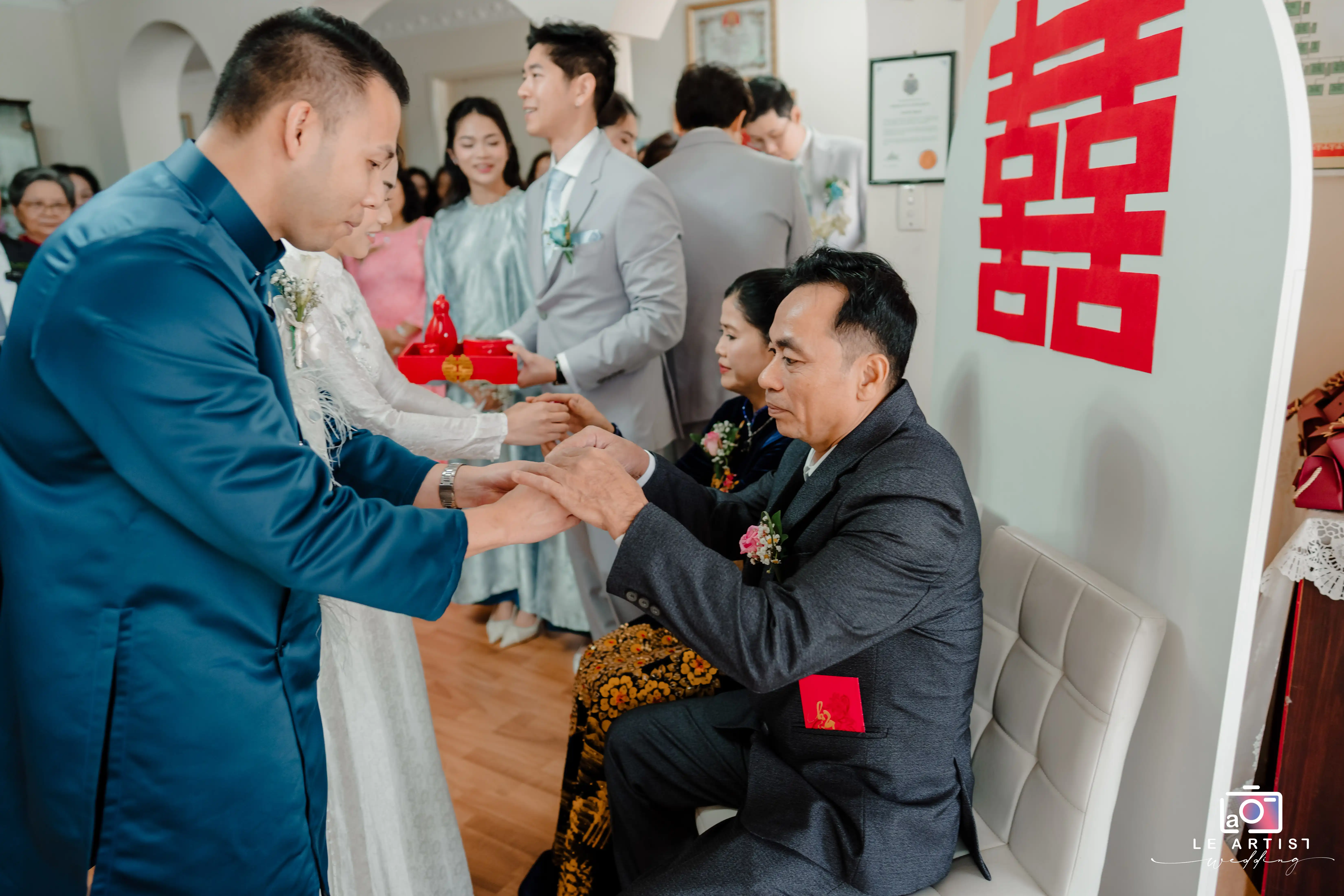 A traditional wedding ceremony exchange involving blessings and gifts. Le Artist Wedding