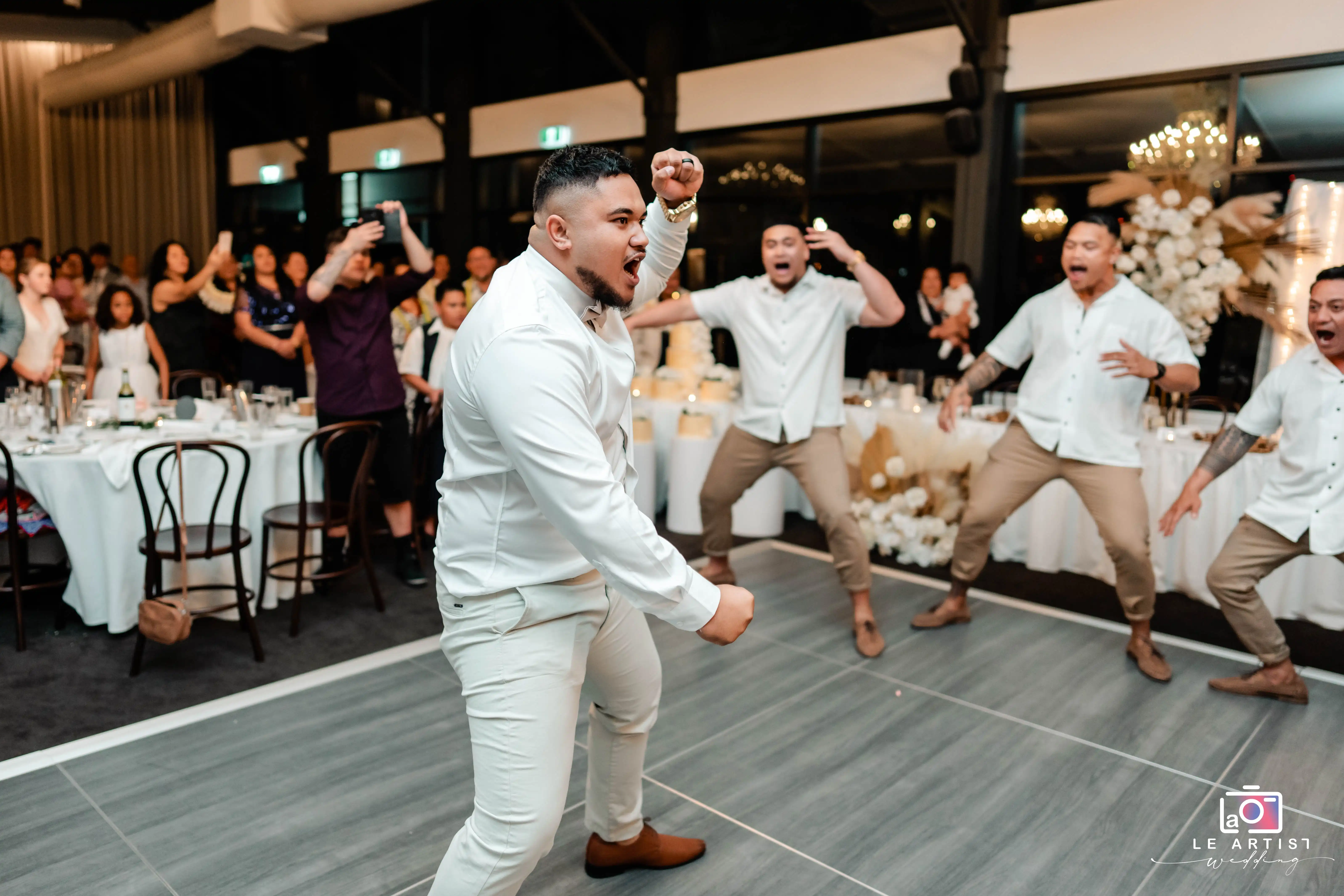A lively performance by the groomsmen energizes the wedding reception party, capturing the guests' attention. Le Artist Wedding