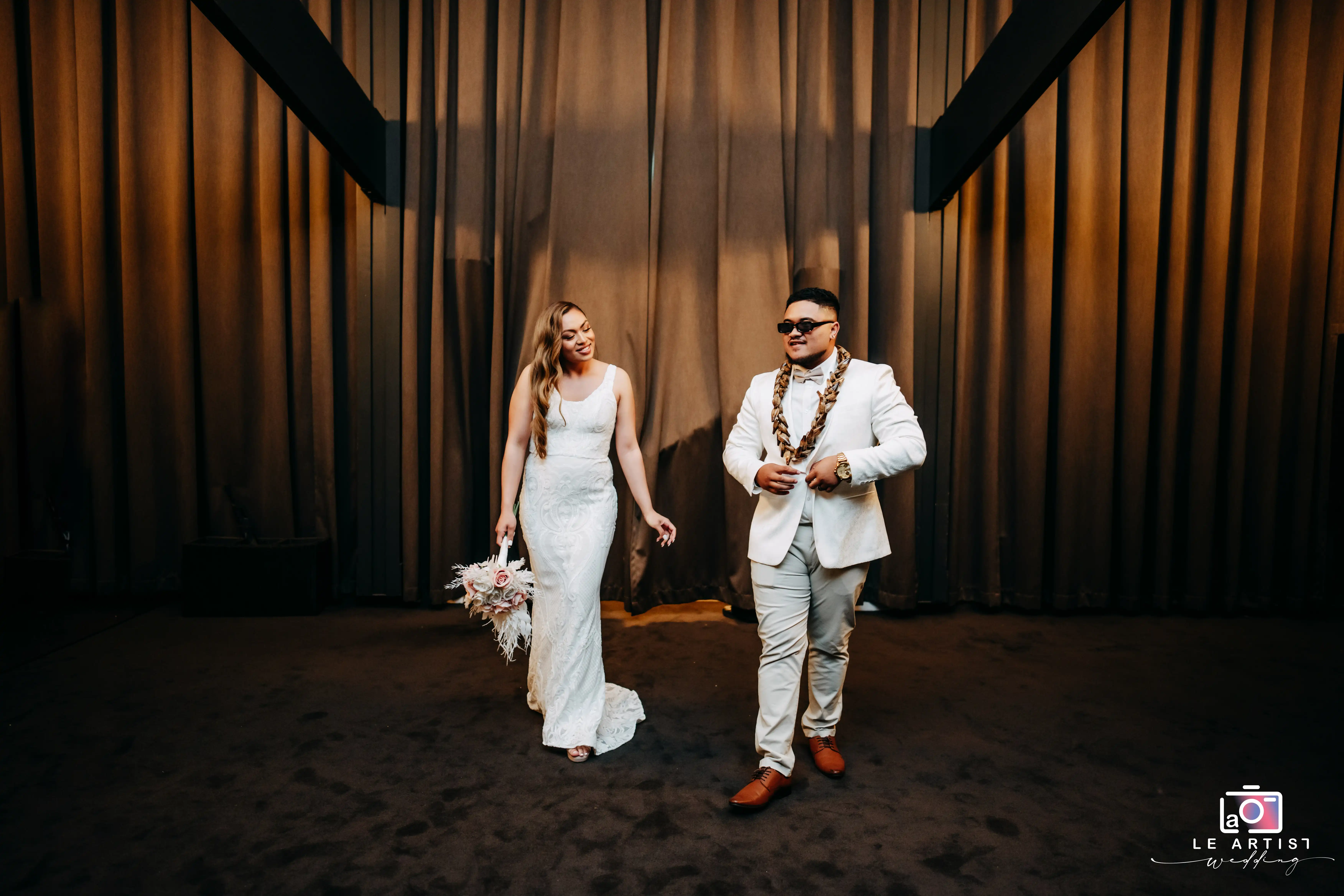 The newlyweds make a stylish entrance at the reception, setting the tone for the party. Le Artist Wedding