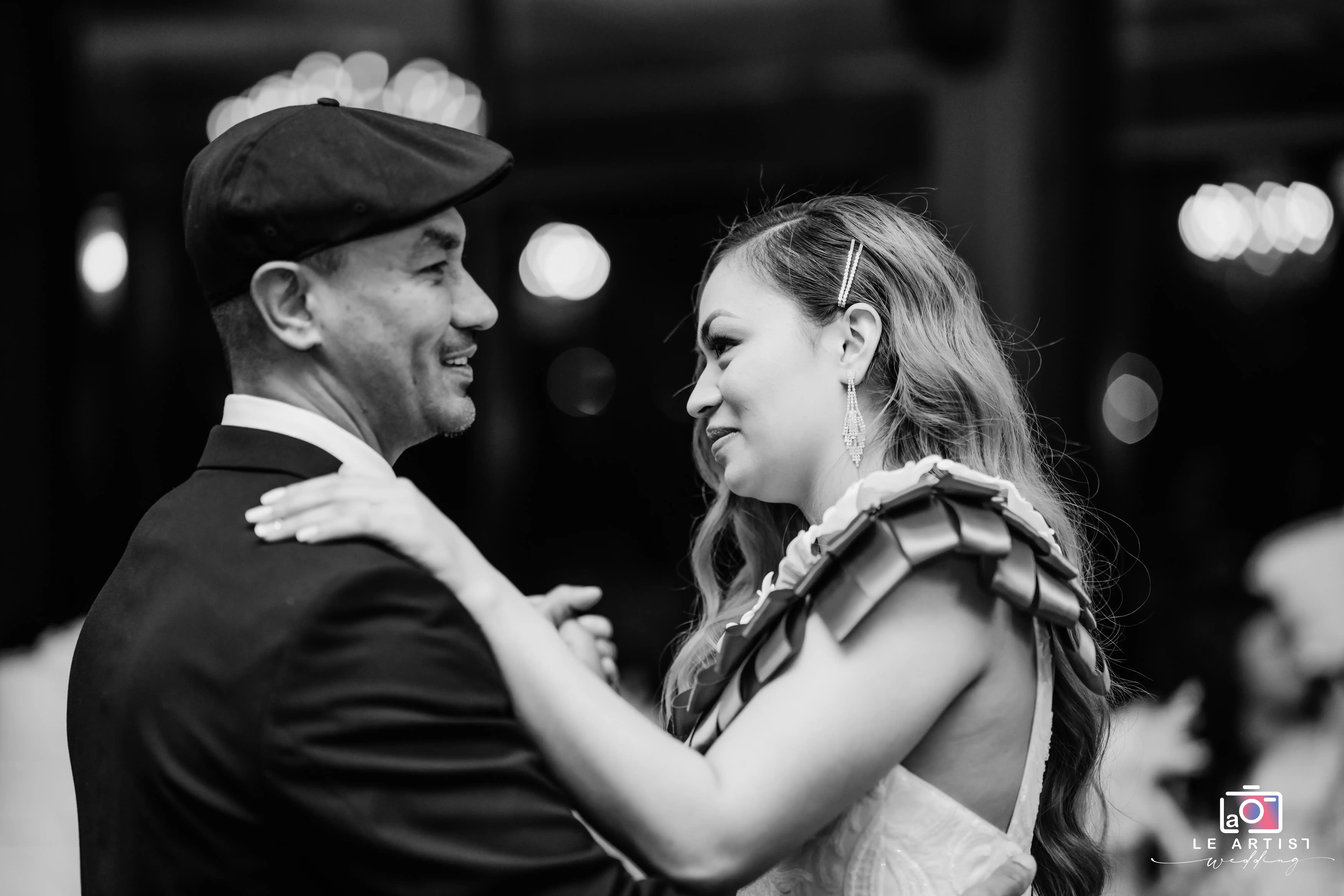 A special moment shared on the dance floor, captured in black and white. Le Artist Wedding